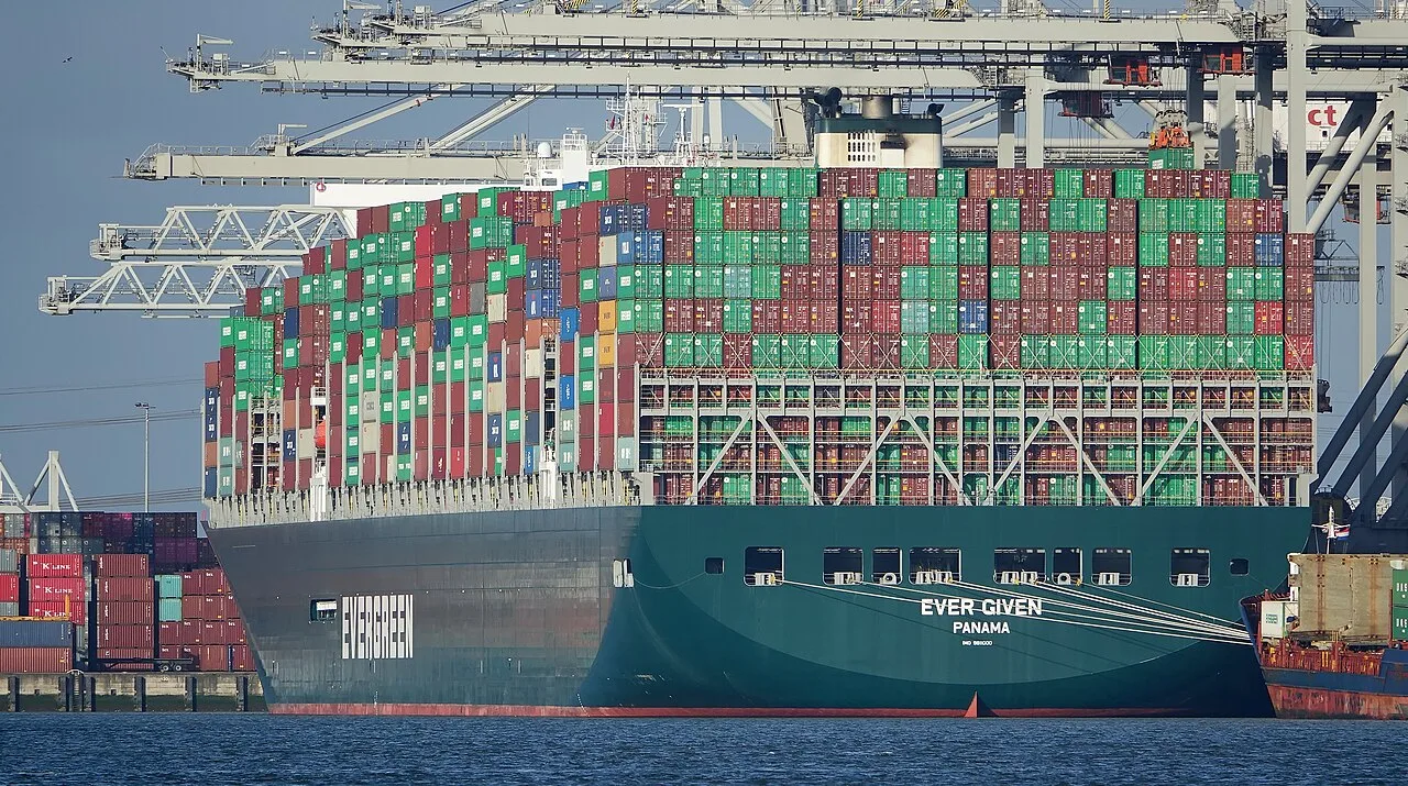 Ever Given moored at a container terminal, viewed from the stern.