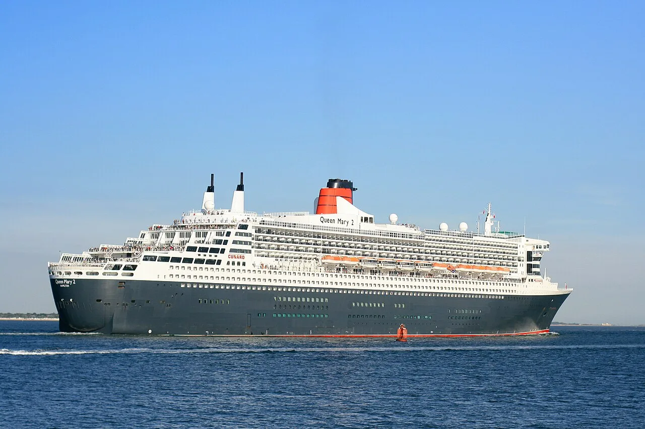 Queen Mary 2 departing Southampton, showing its long forebody and passenger superstructure